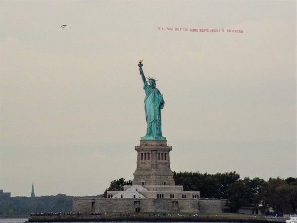 Plane towing a banner was flown around Statue of Liberty to bring international attention towards human rights violations in Balochistan. Photo/ANI