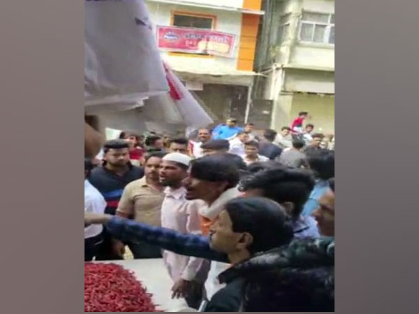 A trader used red chilli powder to stop protestors from closing his shop. Photo/ANI