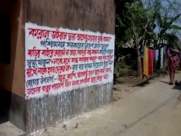 One of the walls in the village painted with the meassage on coronavirus. Photo/ANI