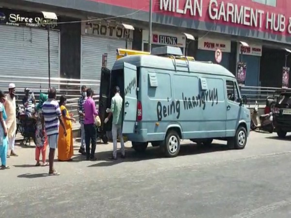 Volunteers of Salman Khan's food truck initiative 'Being Haangryy' distributing ration kits to the needy in Mumbai (Photo/ANI)