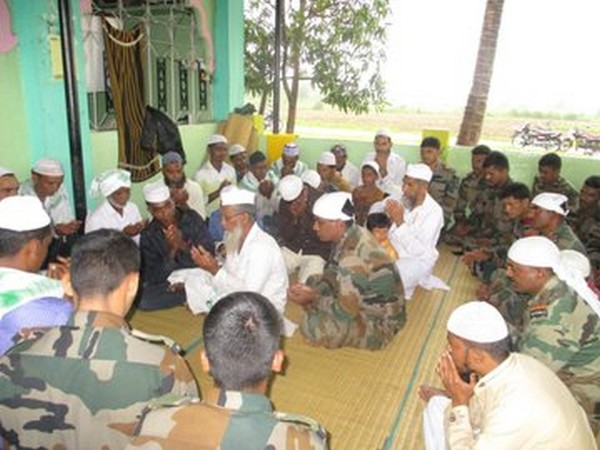 Locals celebrating Eid with members of the Maratha Light Infantry unit on Monday in Belagavi. Photo/ANI