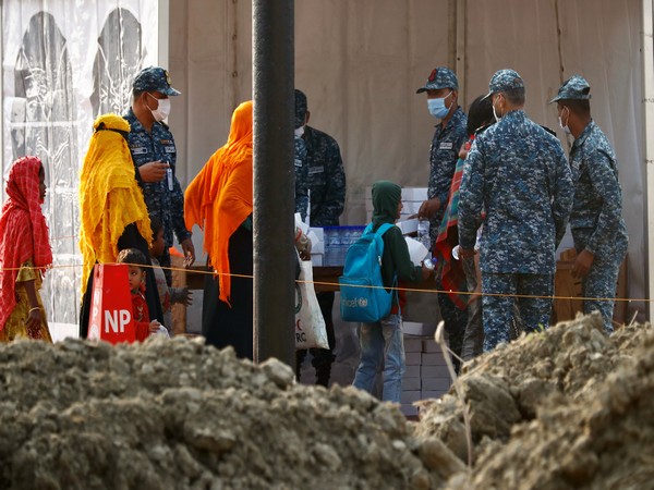 Rohingya refugees were provided with food before they were relocated to Bhasan Char. (Photo credit: Reuters)