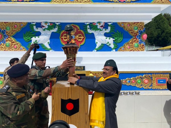 MoS Defence Ajay Bhatt receives the 'Swarnim Vijay Mashaal'. (Image courtesy: Twitter/ @AjaybhattBJP4UK)