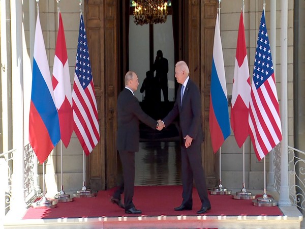 US President greets Russian counterpart Vladimir Putin with a handshake in Geneva (Photo Credit - CNN)