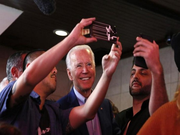 US Democratic presidential candidate Joe Biden takes selfies with fans in Los Angeles