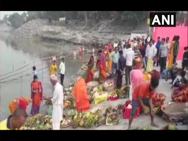 Devotees take part in Chhath Puja celebrations at ghats near Aurai (Photo ANI)