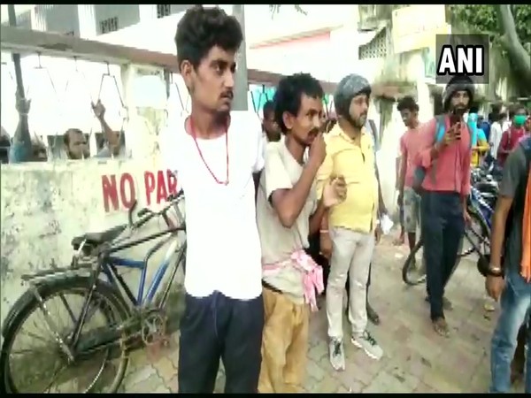 The two men tied to a pole in Muzaffarpur. (Photo/ANI)