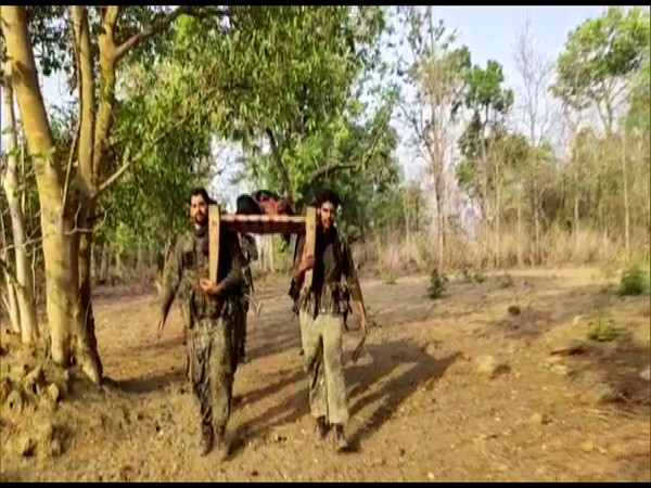 CRPF personnel carrying the injured village to hopital. Photo/ANI