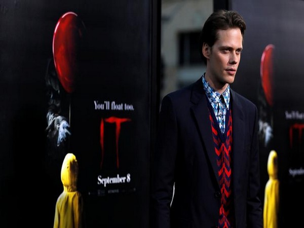 Bill Skarsgard poses at the premiere for 