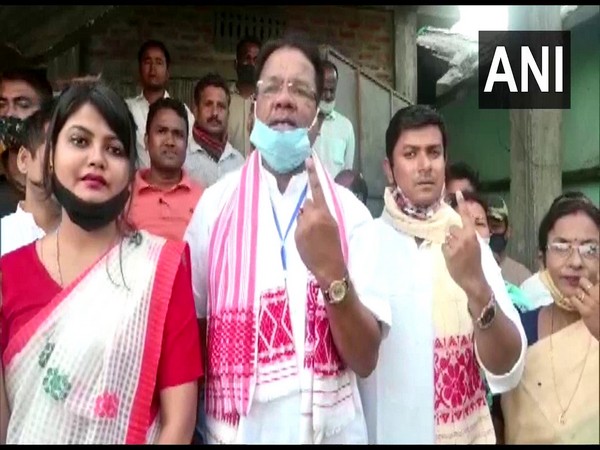 Assam Congress Chief Ripun Bora, along with his family, casts his vote at a polling booth in Gohpur. (File photo)