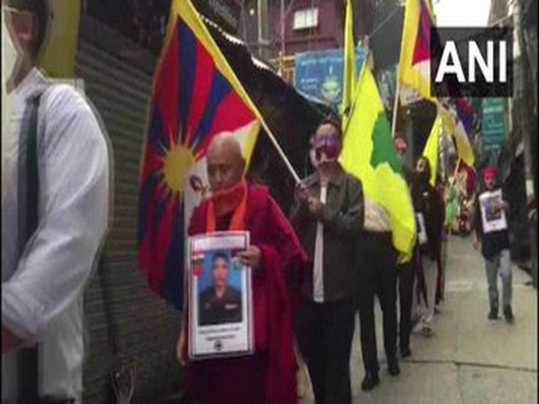 Members of the Tibetan community participating in a candlelight vigil in McLeod Ganj. [Photo/ANI]