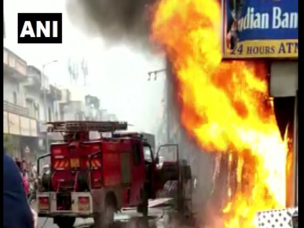 A fire brigade rushes to the spot of the ATM fire
