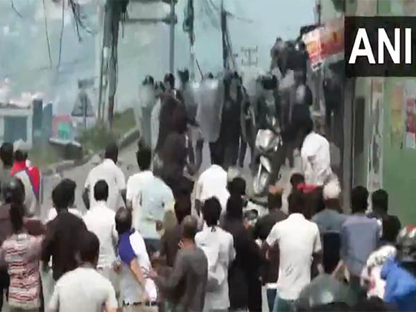 Protesters chase and pelt stones at security personnel in Kathmandu (Photo/ANI)