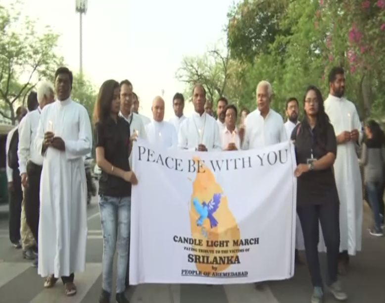 Visuals of people in the candle light march in Ahmedabad on Sunday. Photo/ANI