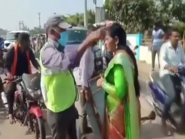YSRCP leader D Revathi arguing with the toll plaza staffer in Guntur district on Thursday. (Photo/ANI)
