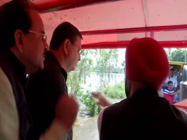 Uttarakhand CM Pushkar Singh Dhami inspecting flood-hit areas of Khatima. (Photo/ANI)