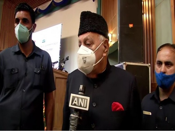 National Conference leader Farooq Abdullah talking to ANI on Tuesday. (Photos/ANI)