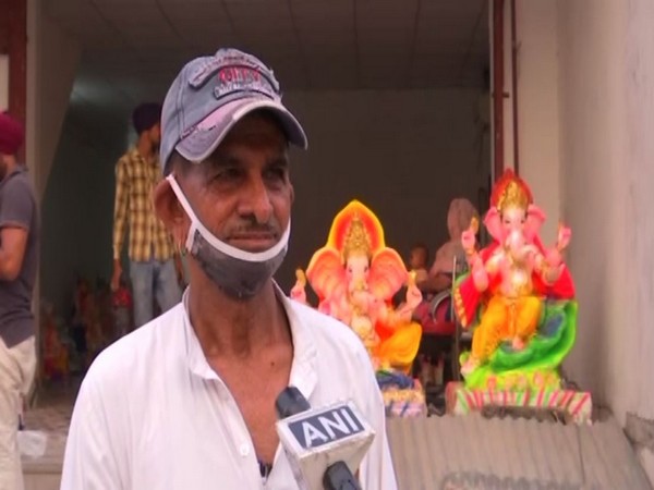 Phool Kumar, an artist who makes eco-friendly Ganesha idols. (Photos/ANI)