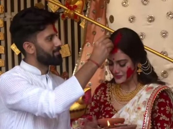 Trinamool Congress (TMC) lawmaker Nusrat Jahan playing 'Sindoor Khela' with her husband Nikhil Jain on Friday in Kolkata. Photo/ANI