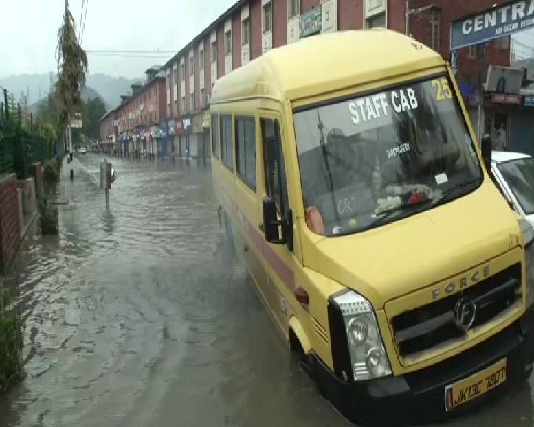 Vehicles broke down due to massive water-logging following heavy downpour in Srinagar, Jammu and Kashmir on Thursday morning (Photo/ANI)