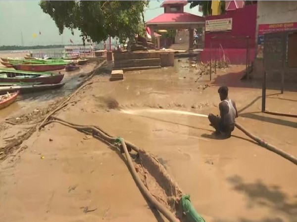 The accumulated mud being removed from a 'ghat' in Varanasi on Monday. Photo/ANI