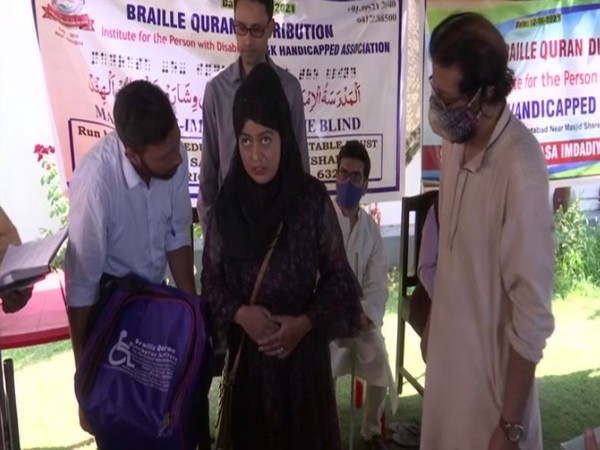 Student receiving Quran written in Braille system in Srinagar (Photo/ANI)
