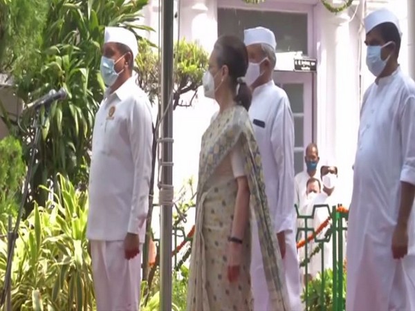Congress president Sonia Gandhi hoists the National Flag at AICC headquarters