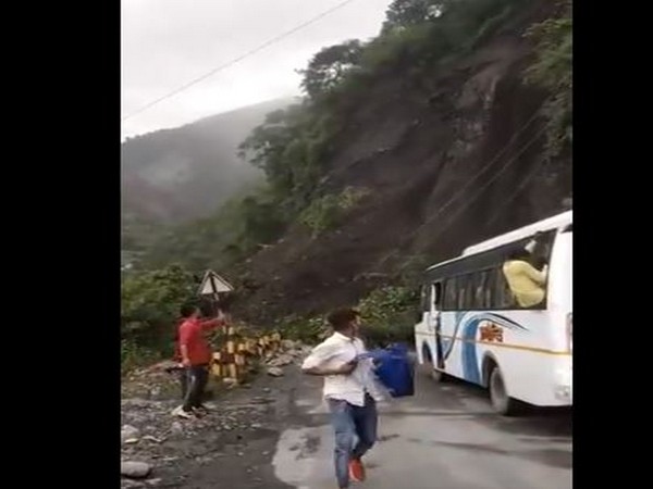 Passengers escaping from the bus. (Photo/ANI)