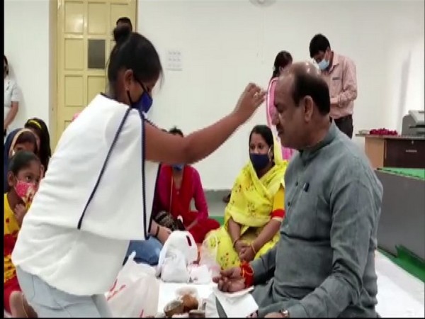 Visual of Lok Sabha Speaker Om Birla getting Rakhi tied by a woman (Photo/ANI)  