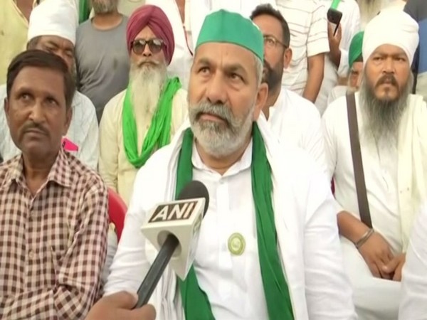 BKU leader Rakesh Tikait at deceased journalist Raman Kashyap's house. (Photo/ANI)