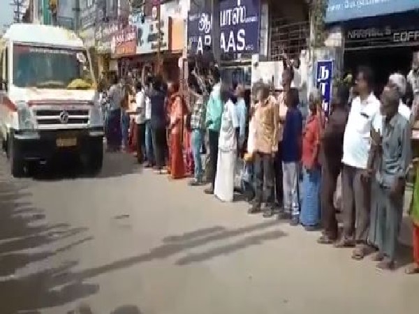 Locals shower flower petals as ambulances carrying the mortal remains of CDS Bipin Rawat, his wife and 11 defence personnel leave for Sulur airbase. (Photo/ANI)