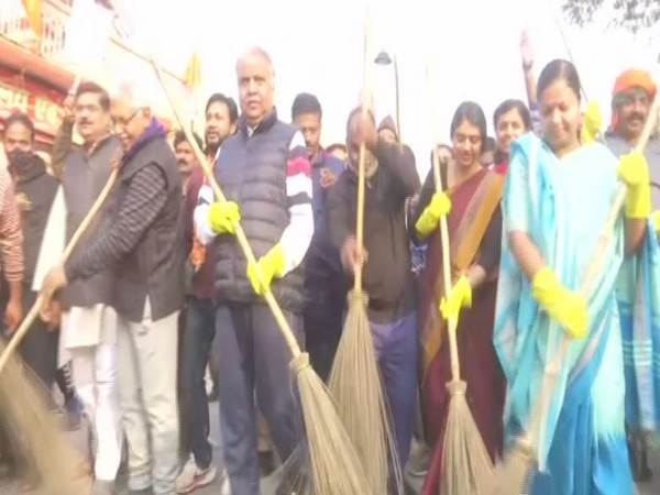 BJP workers cleaning streets in Varanasi (Photo/ANI)