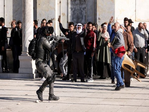 An Israeli security forces member moves in position during clashes with Palestinian protestors at the compound that houses Al-Aqsa Mosque (Photo Credit: Reuters)