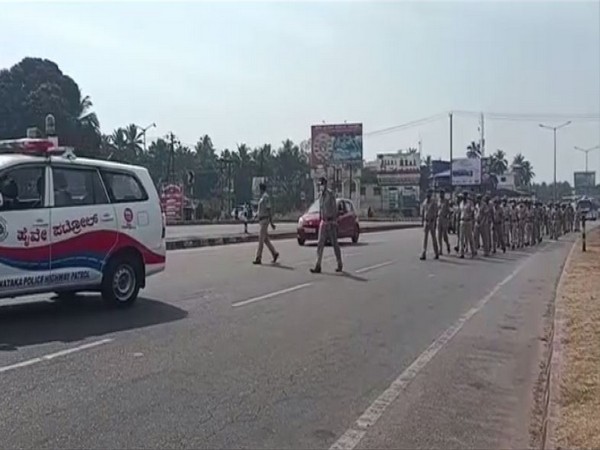 Police held a flag march as a precationary measure ahead of re-opening of schools amid Hijab row. (Photo/ANI)