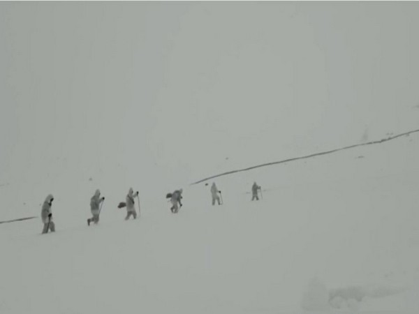 A visual of the Himveers of ITBP patrolling the borders in heavy snowfall. (Photo/ANI)