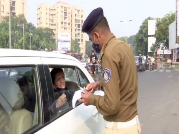 Visual of police personnel collecting fine.