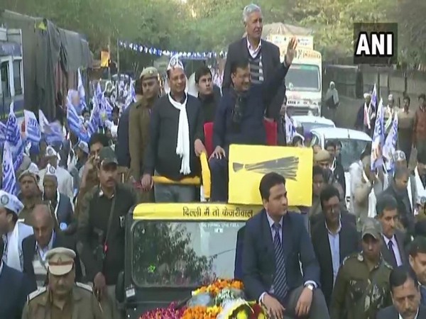 Delhi Chief Minister Arvind Kejriwal holding a roadshow in Shakur Basti on Wednesday.