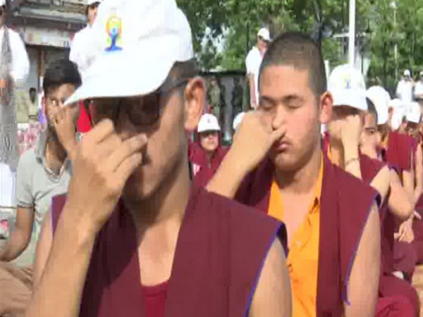 Buddhist monks perform yoga on the occasion of 5th International Yoga Day 