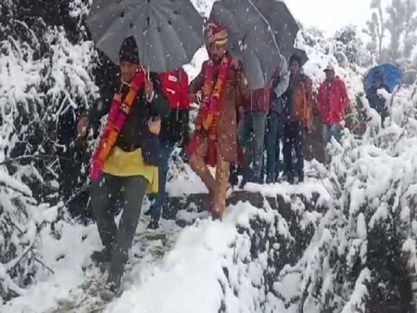 Groom walked for four kilometers on foot to reach the bride's home in Bijra village in Chamoli (Photo/ANI)