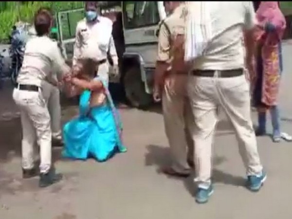 A woman was allegedly beaten up and dragged by some police personnel in MP (Photo/ANI)