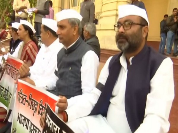 Congress leaders stage a protest in the Assembly premises in Lucknow on Tuesday (Photo/ANI)