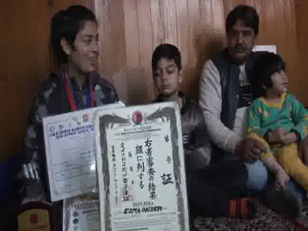 Esra Binti Qaiser with her two siblings and father in Srinagar on Saturday. Photo/ANI