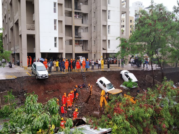 At least 15 people died and some others injured in a wall collapse incident  in Pune on Saturday. Photo/ANI