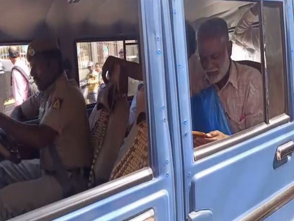 Police taking people into custody in Hubli, Karnataka on Thursday.