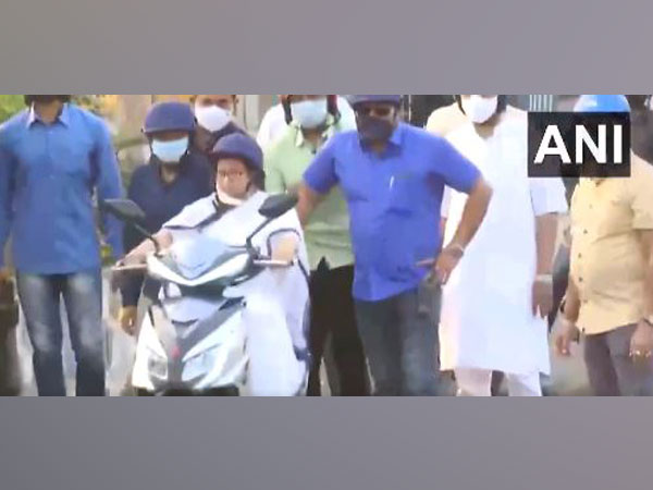 West Bengal Chief Minister Mamata Banerjee riding e-scooter (Photo/ANI)
