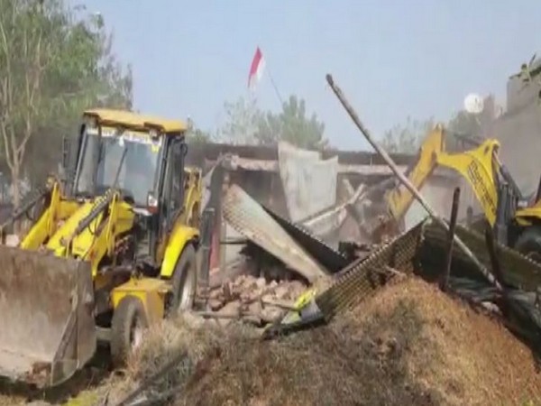 Visual of authorities demolishing encroachments in Super Corridor area of Indore. (Photo/ANI)