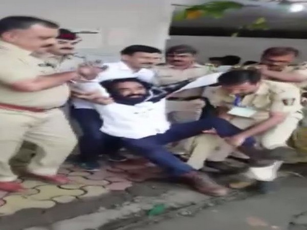 A Bahujan Samaj Party (BSP) leader, Sunil Khambe was held by police for throwing ink on the EVM at a polling booth in Thane on Monday 