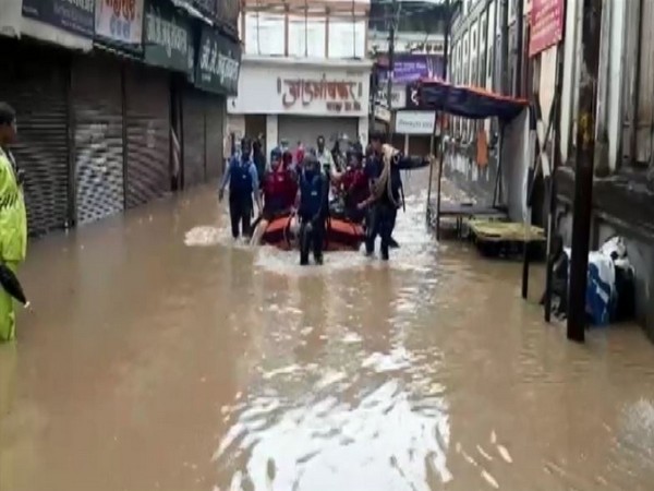 The National Disaster Response Force (NDRF) troops rescue residents from the flood affected areas in Nashik on Sunday. (Photo/ANI)