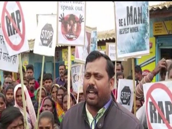 Locals hold protest in Mahubana village to demand justice for minor girl, who was found dead in a pit. (Photo/ANI)