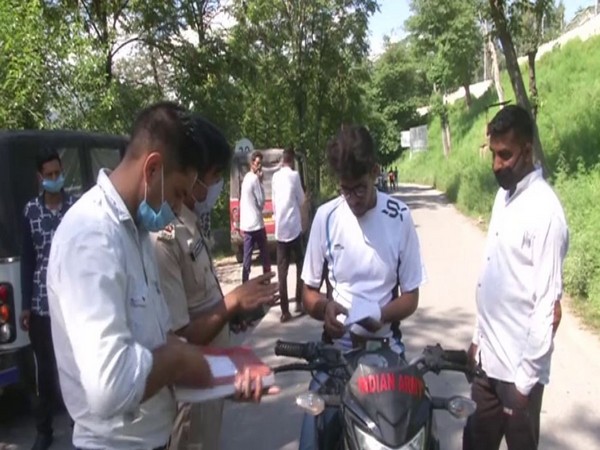 Transport department launched drive against commuters not following COVID-19 SOPs in Poonch district (Photo/ANI)